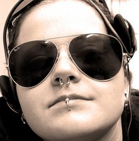 Female pierced through the following: Lobe (Ear), Septum (Nose), Labret (Lips)