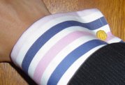 This French cuff is fastened with gold-coloured silk knots.