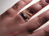 A white gold wedding ring.