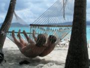 A couple in a hammock on the beach
