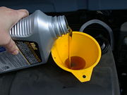 Synthetic motor oil being poured.