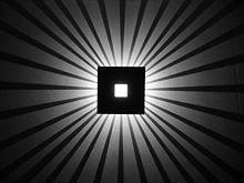 Wall-mounted light with shadows.