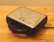 A photo of the same toaster when closed.