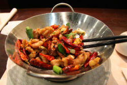 A meal served in a decorative wok, Hong Kong