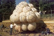 NASA engineers test the Mars Pathfinder airbag landing system on simulated martian terrain.