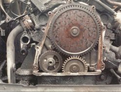 Valve timing gears on a Ford Taunus V4 engine — the small gear is on the crankshaft, the larger gear is on the camshaft. The gear ratio causes the camshaft to run at half the RPM of the crankshaft.