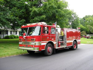 Fire Engine in South Bend, Indiana.  Note the pump equipment in the middle of the vehicle's side.