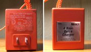 A simple quick charger. It’s simply an AC-DC wall adapter. It applies 300mA to the battery at all times making it very easy to damage the battery if left connected too long.